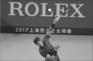  ?? ANDY WONG, THE ASSOCIATED PRESS ?? Rafael Nadal of Spain serves against Fabio Fognini of Italy in their singles match in the Shanghai Masters on Friday.