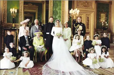  ??  ?? The Duke and Duchess of Sussex in the Green Drawing Room, Windsor Castle, with (leftto-right): Back row: Master Jasper Dyer, the Duchess of Cornwall, the Prince of Wales, Ms Doria Ragland, The Duke of Cambridge; middle row: Master Brian Mulroney, the Duke of Edinburgh, Queen Elizabeth II, the Duchess of Cambridge, Princess Charlotte, Prince George, Miss Rylan Litt, Master John Mulroney; front row: Miss Ivy Mulroney, Miss Florence van Cutsem, Miss Zalie Warren and Miss Remi Litt