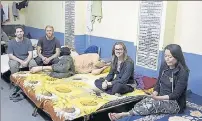  ?? SAMEER SEHGAL/HT ?? (Left) The Sri Guru Ram Das Niwas in the Golden Temple complex in Amritsar; foreign visitors staying in a room of the serai.