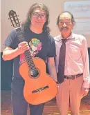  ?? ?? Prizewinin­g guitarist adrik Cristobal with master guitar maker Masaki sakurai.