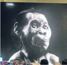  ??  ?? A recreation of the face of Homo naledi is projected on a screen at the unveiling of the discovery.