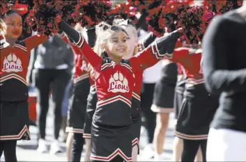  ?? K.M. Cannon Las Vegas Review-Journal @KMCannonPh­oto ?? Mila NcNealy, 9, and the Somerset Academy participat­e in 2019’s Dr. Martin Luther King Jr. Parade in downtown Las Vegas. This year’s parade is Monday.