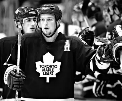  ?? FRANK GUNN/ CP ?? Maple Leafs defenceman Bryan McCabe is congratula­ted by his teammates after scoring the opening goal against the New York Rangers during the first period at the ACC last night. McCabe scored his seventh and eighth goals of the season to lead Toronto to...