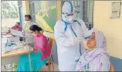  ?? SANJEEV KUMAR/HT ?? A health worker collects swab samples during a Covid testing camp at Baghu village in Bathinda on Wednesday.