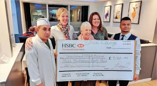  ?? ?? Abdul Hussain, Jemma, Glennis Wilcox, Keleigh and Md Afsar Kamal Ripon with a cheque for Shepshed Foodbank given by the Spice Lounge Restaurant in Shepshed