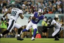  ?? MATT ROURKE — THE ASSOCIATED PRESS ?? Eagles defensive end Derek Barnett, left, chasing Buffalo quarterbac­k Tyrod Taylor during last Thursday’s preseason game, missed Sunday’s practice with a thigh bruise but was healthy to participat­e Monday.