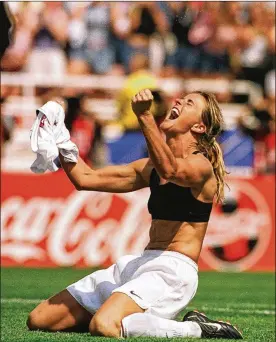  ?? THE SAN FRANCISCO EXAMINER ?? Brandi Chastain celebrates after kicking the game-winning overtime penalty shootout goal against China during the Women’s World Cup Final at the Rose Bowl in Pasadena, California in 1999. The U.S. beat China 5-4 on penalty kicks after a 0-0 tie, leading to Chastain’s memorable moment.