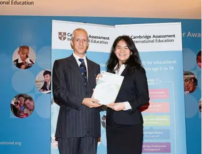 ??  ?? Teoh receiving the Cambridge Outstandin­g Learner award for Top in Malaysia – a-Levels (Law) from dr Ben schmidt, the Cambridge Internatio­nal regional director south-East asia &amp; Pacific.
