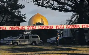  ?? AP ?? A police officer stands guard in front of the Masjid Al Noor, where contractor­s have been working ’’relentless­ly’’ so it can be open for prayers tomorrow. Khaled Alhaj Mustafa in a photograph taken in late 2017 or early 2018.