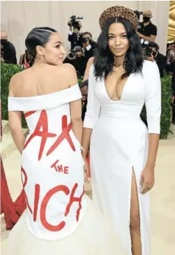  ?? PICTURE: MIKE COPPOLA/GETTY ?? Alexandria Ocasio-Cortez and Aurora James at the 2021 Met Gala in New York.