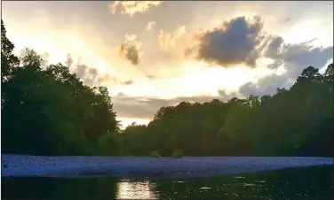  ?? (Arkansas Democrat-Gazette/Bryan Hendricks) ?? A brilliant sunset capped a superb day of fishing Sunday on the Caddo River.