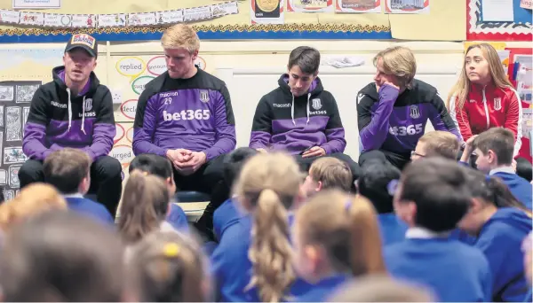  ??  ?? GOOD TO TALK: Stoke City midfielder Ryan Woods, left, visited the Hassell County Primary School in Newcastle yesterday afternoon along wih Jakob Haugaard, Bojan and Moritz Bauer. Picture: Phil GREIG/SCFC