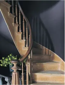  ??  ?? Shadow 2117-30, Benjamin Moore’s colour of the year for 2017, is a purple shade that varies according to how the light hits it. Here, it is used as a dramatic backdrop to a winding staircase made of light-coloured wood.
