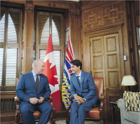  ?? SEAN KILPATRICK / THE CANADIAN PRESS ?? B.C. Premier John Horgan’s decision not to discuss the Trans Mountain pipeline following his meeting with Prime Minister Justin Trudeau in Ottawa on Tuesday hints at a growing reluctance to fight the project, writes John Ivison.