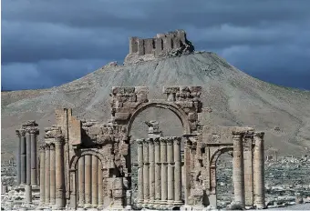  ?? JOSEPH EID/AFP/Getty Images files ?? ISIL fighters this week seized control of the ancient Syrian city of Palmyra, northeast of Damascus,
putting the world heritage site at risk of destructio­n.