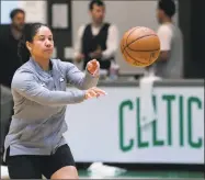  ?? Charles Krupa / Associated Press ?? Boston Celtics assistant coach Kara Lawson passes the ball at the team’s training facility in Boston.