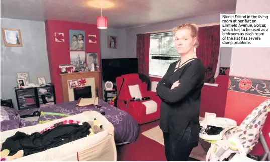  ??  ?? Nicole Friend in the living room at her flat on Elmfield Avenue, Golcar, which has to be used as a bedroom as each room of the flat has severe damp problems