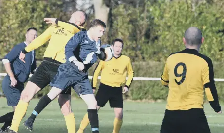  ??  ?? Penshaw Catholic Club Over-40s (yellow) in action against Darlington Shuttle &amp; Loom at Herrington Welfare Park on Saturday.