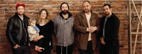  ?? LAURA MCGUIRE ?? The Tacofino team, from left: Jason Sussman, Kaeli Robinsong (with daughter Leni), Gino Di Domenico, Ryan Spong and Anthony Sterne.