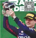  ?? – AFPPIX ?? Red Bull Racing’s Max Verstappen celebrates on the podium after winning the Emilia Romagna F1 GP at the Autodromo Internazio­nale Enzo e Dino Ferrari race track in Imola, Italy.