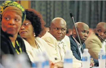  ?? Pictures: WERNER HILLS ?? TOEING THE LINE: A subdued UDM councillor Mongameli Bobani, centre, during the meeting called to debate a motion of no-confidence in mayor Athol Trollip