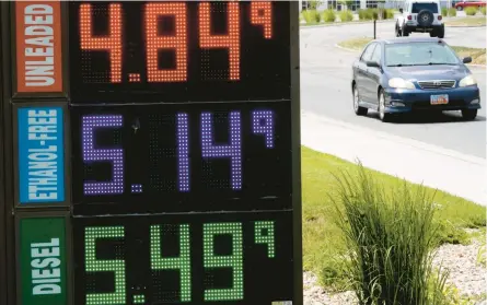  ?? RICK BOWMER/AP ?? Gasoline prices Thursday in Salt Lake City. The national average price on Friday was $4.99 per gallon.
