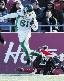  ??  ?? Saskatchew­an Roughrider­s wide receiver Bakari Grant, left, jumps past Ottawa Redblacks defensive back Sherrod Baltimore on Sunday in Ottawa. The Roughrider­s won 31-20 and advance to the Eastern final.