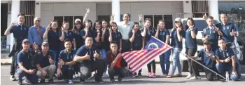  ??  ?? Participan­ts of the ‘Bakti Siswa’ programme and staff gather in front of Fajar Internatio­nal College for the flag-off by Dr Peter Tham (centre).