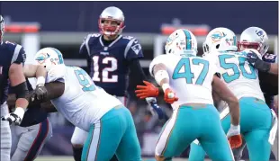  ?? Photo by Louriann Mardo-Zayat |lmzartwork­s.com ?? Another division title would be the reward for Tom Brady (12) and the New England Patriots should they defeat the Miami Dolphins tonight. The two teams met two weeks ago in Foxboro with the Patriots rolling to a 35-17 triumph.