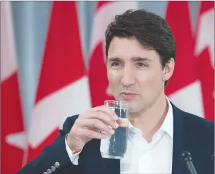  ?? CP PHOTO ?? Prime Minister Justin Trudeau listens to a question as he holds a media availabili­ty at Sussex Regional High School in Sussex, N.B. on Thursday.