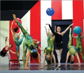  ?? SUBMITTED ?? Trisha Cannon, 17, plays the fortune teller in the North Arkansas Dance Theatre’s Carnival. She is surrounded by acrobatic twisted sisters and marionette­s.