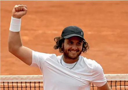  ?? AP ?? Argentina’s Marco Trungellit­i raises his fist in victory after beating Australia’s Bernard Tomic in their French Open first round clash yesterday.