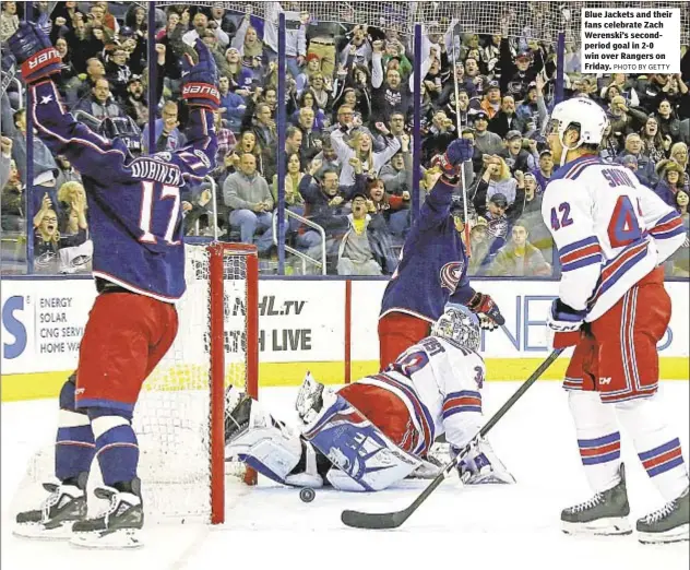  ?? PHOTO BY GETTY ?? Blue Jackets and their fans celebrate Zach Werenski’s secondperi­od goal in 2-0 win over Rangers on Friday.