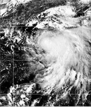  ?? NOAA via AP ?? This satellite photo provided by the National Oceanic and Atmospheri­c Administra­tion shows Tropical Storm Sally, on Sunday, at 2050 GMT.