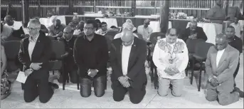  ??  ?? Ministers of government also kneeled in prayer as the Akawaio Aleluya Religious Group offered their blessings. (Terrence Thompson photo)