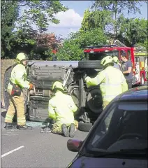  ??  ?? Firefighte­rs at the scene of the accident