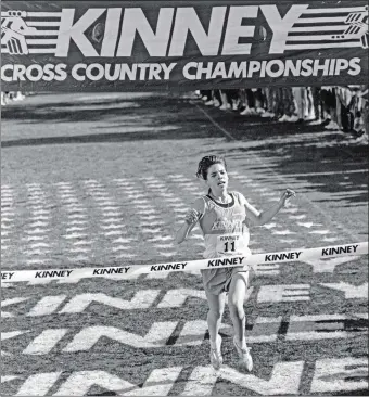  ?? DAY FILE PHOTO ?? Liz Mueller crosses the finish line to win the 1991 Kinney national high school cross country championsh­p in San Diego. The 1993 Waterford High School graduate won four straight Eastern Connecticu­t Conference, Class M, State Open and New England cross country championsh­ips from 1989-1992.