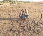  ??  ?? Friends wrote Jemma’s name on Ainsdale beach