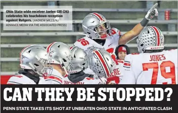  ?? [ANDREW MILLS/NJ ADVANCE MEDIA VIA THE ASSOCIATED PRESS] ?? Ohio State wide receiver Jaelen Gill (26) celebrates his touchdown reception against Rutgers.