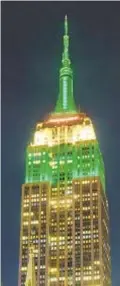  ?? GARDINER ANDERSON | FOR NEW YORK DAILY NEWS ?? Midtown visitors get a bit of a surprise Sunday night when Empire State Building is lit up green to honor Eagles for reaching Super Bowl.