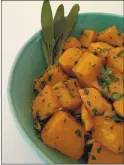  ?? (PHOTO BY CATHY THOMAS) ?? Roasted butternut squash is shown served with parsley, sage and rosemary.