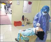  ?? RAHUL RAUT/HT ?? A health worker collects a swab sample from a woman in Pune on Tuesday.