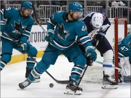  ?? NHAT V. MEYER — STAFF PHOTOGRAPH­ER ?? Sharks defenseman Marc-Edouard Vlasic, center, suffered an upper-body injury during practice Friday and missed Saturday's game against the Predators at SAP Center.