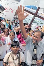  ?? EPA ?? Pakistani Christians shout slogans against bomb blasts that targeted a church in Peshawar, during a protest in Faisalabad, Pakistan, yesterday. Two suicide bombers on Sunday targeted a Mass at a church in north-western Pakistan, killing 81 people in...