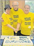  ?? DESIREE ANSTEY/ JOURNAL PIONEER ?? Nancy Clark, left, Irving Arsenault and Donna Waite cut the cancer survivor cake donated by major supporter of the fundraiser, WestJet. All three have been personally affected by cancer.