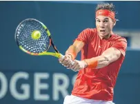  ??  ?? Rafael Nadal hits a backhand return during his match against Stan Wawrinka in Toronto.