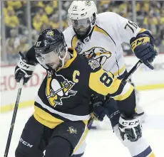  ?? KEITH SRAKOCIC/ASSOCIATED PRESS ?? Pittsburgh Penguins captain Sidney Crosby, left, and Nashville Predators defenceman P.K. Subban are key factors in the ratings success of this year’s Stanley Cup Final.