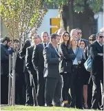  ?? Pictures: AP. ?? Mourners outside Rodef Shalom Congregati­on before the funeral.
