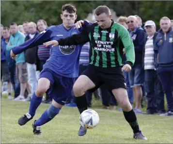  ??  ?? Nathan Watters of Glencormac United challenges Alan O’Neill of Arklow United.