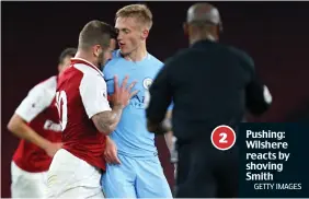  ?? GETTY IMAGES ?? Pushing: Wilshere reacts by shoving Smith